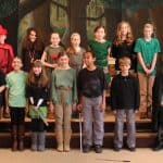 Cast of the Highlands Latin School Robin Hood play pose for a group photo
