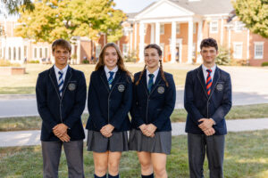 4 Highlands Latin School seniors get recognized as National Merit Scholars in front of the Highlands Latin School building